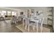 Modern dining area with gray chairs and open concept layout at 1610 Reynolds Rd # 5, Lakeland, FL 33801