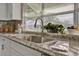 Modern kitchen sink with granite countertop and bay window at 1610 Reynolds Rd # 5, Lakeland, FL 33801