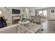 Bright and airy living room with comfortable seating and large TV at 1610 Reynolds Rd # 5, Lakeland, FL 33801