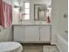Clean bathroom with white vanity, granite countertop, and bathtub at 1610 Reynolds Rd # 5, Lakeland, FL 33801