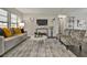 Spacious living room with comfortable seating and a large TV at 1610 Reynolds Rd # 5, Lakeland, FL 33801