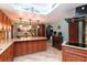 Modern kitchen with wood cabinets, granite counters, and stainless steel appliances at 8723 A D Mims Rd, Orlando, FL 32818
