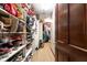 Walk-in closet with ample shelving and hanging space for clothes and shoes at 8723 A D Mims Rd, Orlando, FL 32818