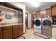 Laundry room with washer, dryer, and ample storage at 8723 A D Mims Rd, Orlando, FL 32818