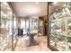 Expansive display room filled with glass showcases, ideal for collectibles at 8723 A D Mims Rd, Orlando, FL 32818