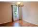 Bright dining room featuring hardwood floors and a chandelier at 1557 Amaryllis Cir, Orlando, FL 32825