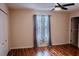 Bedroom with hardwood floors and window coverings at 1557 Amaryllis Cir, Orlando, FL 32825