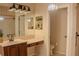 Main bathroom with double vanity and a separate toilet area at 1557 Amaryllis Cir, Orlando, FL 32825