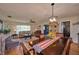 Bright dining room with hardwood floors and view of living room at 6990 Orlando Dr # A, Indian Lake Estates, FL 33855