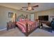 Spacious bedroom with king-size bed, TV, and built-in desk at 6990 Orlando Dr # A, Indian Lake Estates, FL 33855