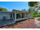 Bright screened-in porch with view of the backyard at 3681 Gardenia Dr, Indian Lake Estates, FL 33855