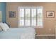 Main bedroom featuring water views and plantation shutters at 5688 Siltstone St, Lakeland, FL 33811