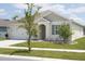 One-story home with a two-car garage and manicured lawn at 5688 Siltstone St, Lakeland, FL 33811