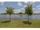 Scenic view of a lake with lush greenery at 5688 Siltstone St, Lakeland, FL 33811