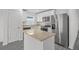 Modern kitchen with stainless steel appliances and granite countertops at 354 Bowfin Ct, Poinciana, FL 34759