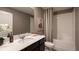 Clean bathroom with a tub and shower, vanity, and a large mirror at 1153 Deepwater Cir, Eagle Lake, FL 33839