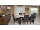 Elegant dining room with a modern table, grey chairs, and stylish decor at 1153 Deepwater Cir, Eagle Lake, FL 33839