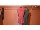 Closet with clothing hanging on rods at 1153 Deepwater Cir, Eagle Lake, FL 33839