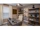 Bright home office with built-in shelving and a large window at 1153 Deepwater Cir, Eagle Lake, FL 33839