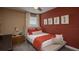 Cozy bedroom with a double bed, nightstand, and neutral wall colors at 1153 Deepwater Cir, Eagle Lake, FL 33839