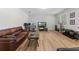 Gathering room with hardwood floors and flat-screen TV at 625 Legacy Park Dr, Casselberry, FL 32707