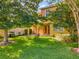 Large backyard with grassy area, patio furniture and grill at 625 Legacy Park Dr, Casselberry, FL 32707