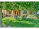 Shady backyard oasis with patio furniture under large tree at 625 Legacy Park Dr, Casselberry, FL 32707