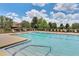 Inviting community pool with lounge chairs and a spacious deck at 625 Legacy Park Dr, Casselberry, FL 32707