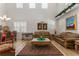 Spacious living room with high ceilings, leather couches, and a formal dining area at 625 Legacy Park Dr, Casselberry, FL 32707