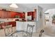 Open kitchen with granite counters and breakfast bar at 625 Legacy Park Dr, Casselberry, FL 32707