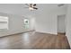 Bright living room featuring hardwood floors and a ceiling fan at 616 Marion Oaks Blvd, Ocala, FL 34473