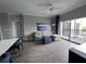 Living room with wood-look floors, and access to balcony at 14501 Grove Resort Ave # 1617, Winter Garden, FL 34787