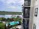 Stunning aerial view of resort-style pool and lake at 14501 Grove Resort Ave # 1617, Winter Garden, FL 34787