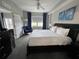 Main bedroom with king-size bed and access to the bathroom at 14501 Grove Resort Ave # 1617, Winter Garden, FL 34787