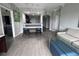 Open living space with wood-look floors, breakfast bar, and comfortable seating at 14501 Grove Resort Ave # 1617, Winter Garden, FL 34787