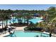 Resort-style pool with expansive deck and lush landscaping at 14501 Grove Resort Ave # 1617, Winter Garden, FL 34787