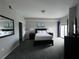 Spacious bedroom with a king-size bed and large windows at 14501 Grove Resort Ave # 1617, Winter Garden, FL 34787
