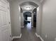 Bright entryway with wood-look floors, leading to living area at 14501 Grove Resort Ave # 1617, Winter Garden, FL 34787