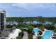 Community pool and lakefront property views at 14501 Grove Resort Ave # 1617, Winter Garden, FL 34787