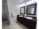Double vanity bathroom with granite countertops at 14501 Grove Resort Ave # 1617, Winter Garden, FL 34787