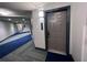 Modern hallway with blue and gray carpeting at 14501 Grove Resort Ave # 1617, Winter Garden, FL 34787