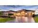 Beautiful two-story home with a paver driveway at 8339 Bridgeport Bay Cir, Mount Dora, FL 32757