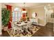 Bright dining room with hardwood floors and elegant chandelier at 8339 Bridgeport Bay Cir, Mount Dora, FL 32757