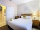 Bedroom with a queen bed and wood-look floors at 2705 Bushman Dr, Kissimmee, FL 34746