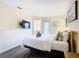 Bright bedroom with a queen-size bed and en-suite bathroom access at 2705 Bushman Dr, Kissimmee, FL 34746