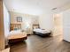 Guest bedroom with two twin beds and wood floors at 2705 Bushman Dr, Kissimmee, FL 34746