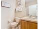 Clean bathroom with toilet, sink, and shower at 2705 Bushman Dr, Kissimmee, FL 34746