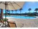 Resort-style pool with lounge chairs and umbrellas at 2705 Bushman Dr, Kissimmee, FL 34746