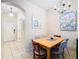 Cozy dining area with a wood table and chairs near entryway at 2705 Bushman Dr, Kissimmee, FL 34746