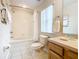 Bathroom with a tub, shower, and wood vanity at 2705 Bushman Dr, Kissimmee, FL 34746